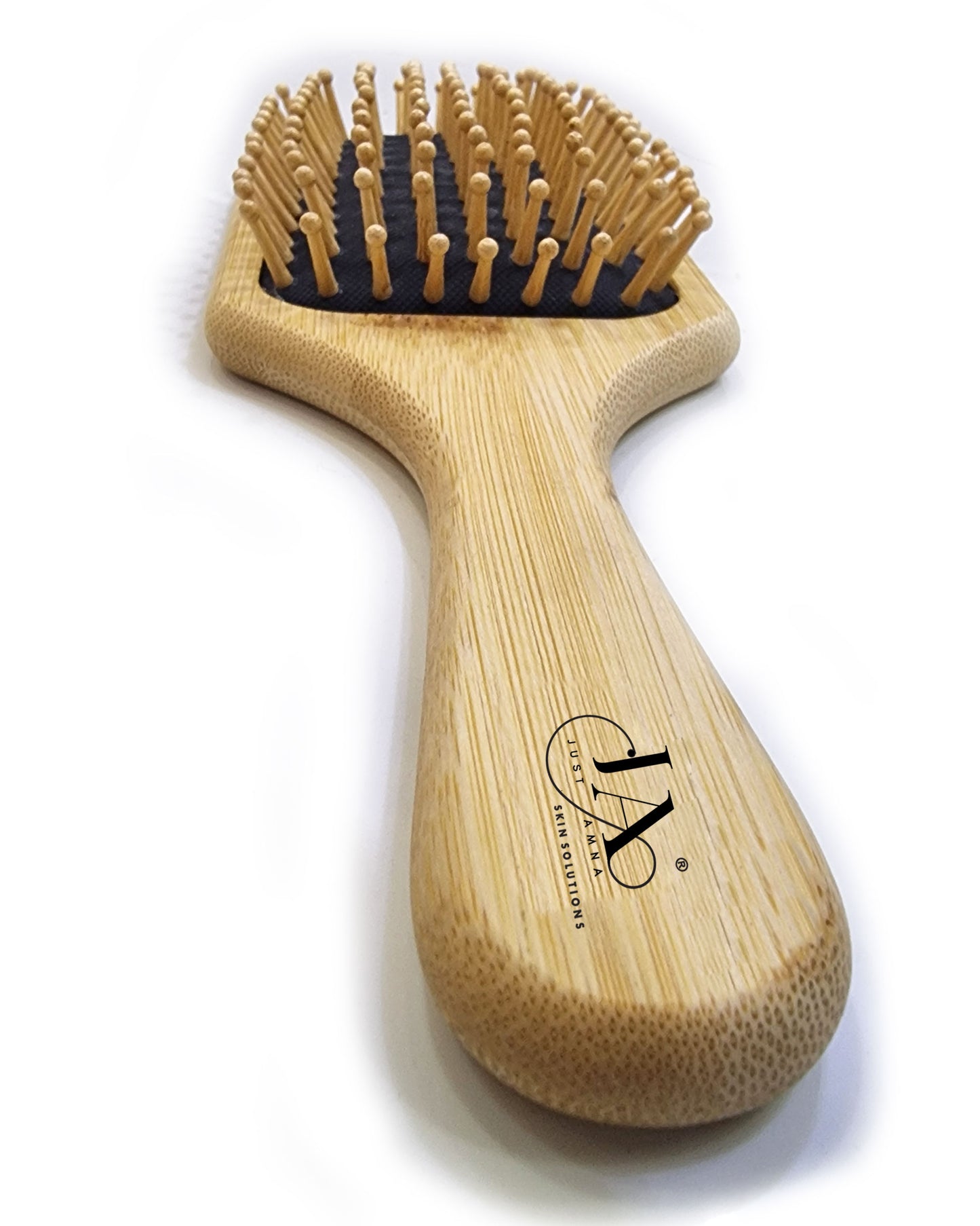 Wooden hairbrush with bristle head on a white background