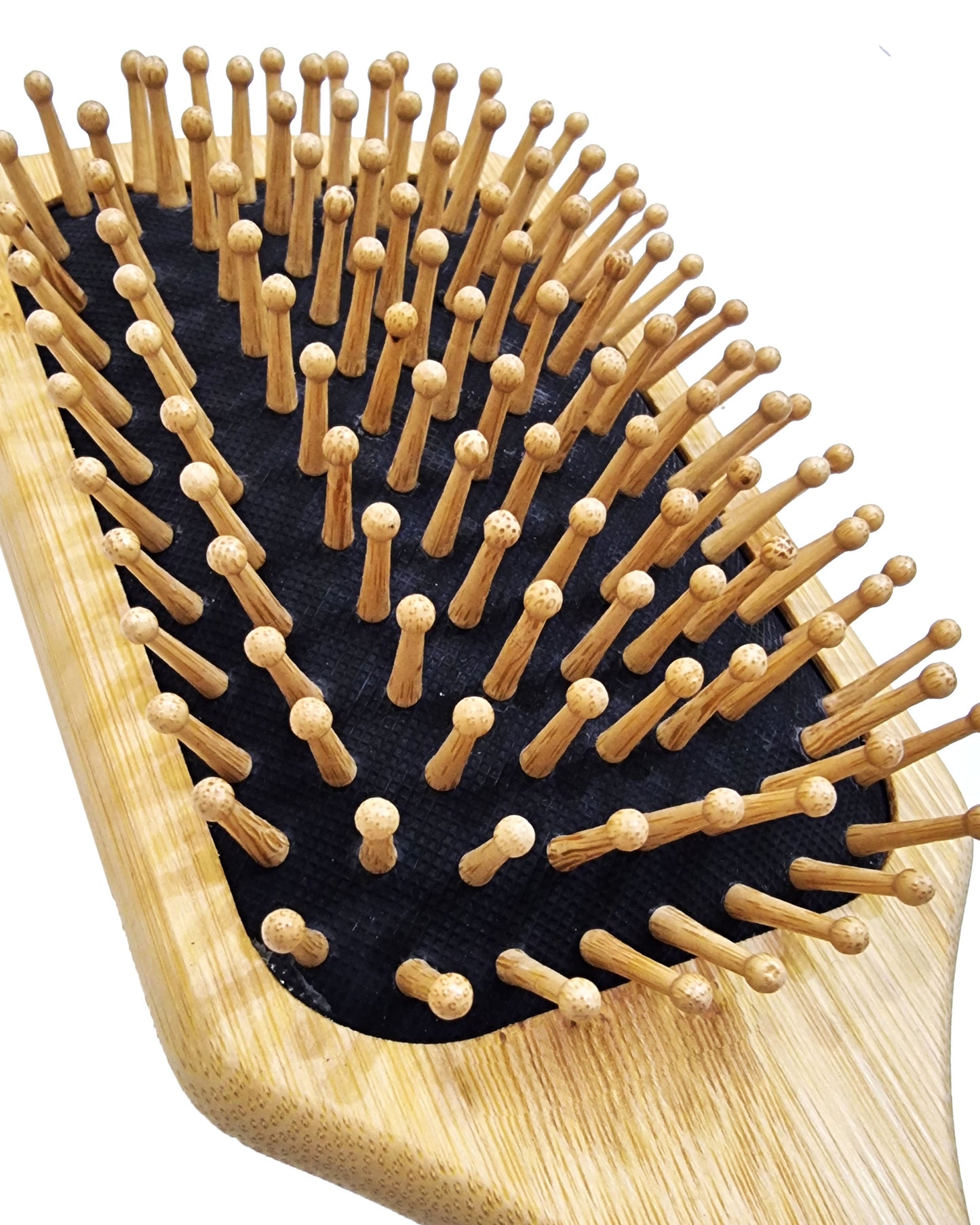 Wooden hairbrush with bristles on a white background